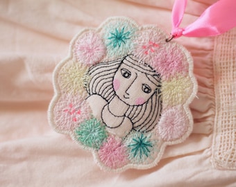 Needle-drawn girl face pendant