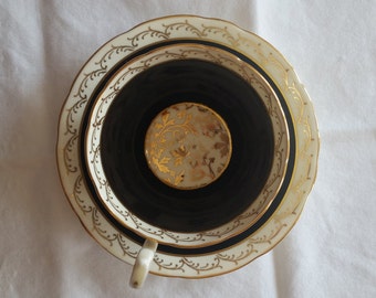Aynsley black and gold teacup and saucer set - marked C341
