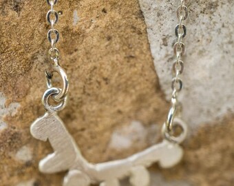 Collier with a tiny silver branch and buds