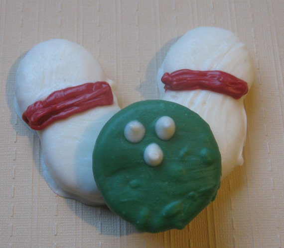 3 piece bowling ball and bowling pins chocolate covered sandwich cookie and peanut butter cookie
