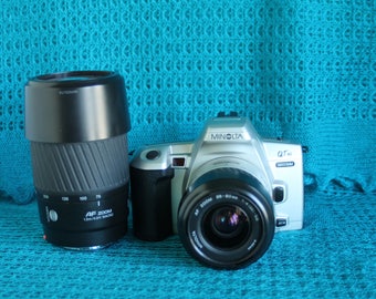 Minolta Maxxum QT si SLR 35mm camera-with 35-80mm, 75-300mm AF Lens