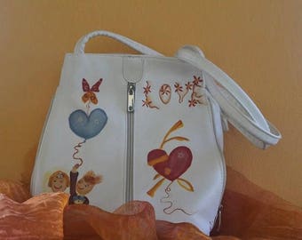 Hand-painted leather bag to be used as a shoulder strap or as a backpack.