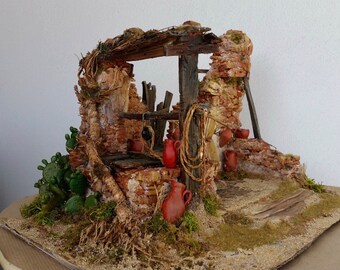 Diorama of a ruin with hand-made well.