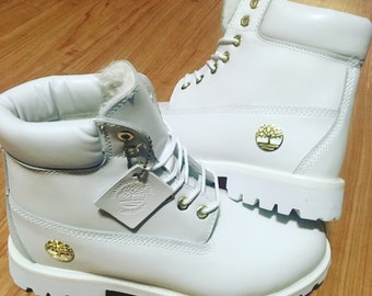 white and gold timbs