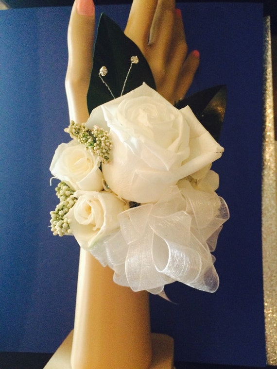 Preserved rose corsage. Roses are soft to the touch but preserved for a forever keepsake.