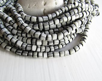 matte black white striped seed bead, small ethnic irregular barrel tube spacer, indonesia New Indo-pacific 3 to 6mm (22 inch strd) 7ab47