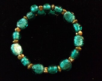 Teal and gold bracelet.