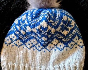 Patterned knit hat with removable pom pom
