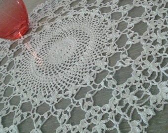 Two white crochet doilies flowers