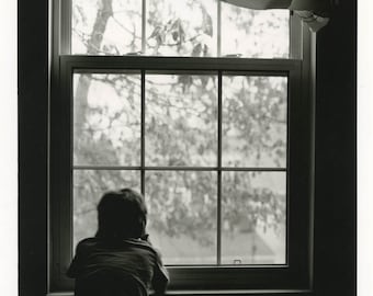 Boy at the window.Silver gelatin print