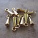 10 Cord end, gold-plated brass, 8x3mm smooth cone with loop, 1mm inside diameter. JD156
