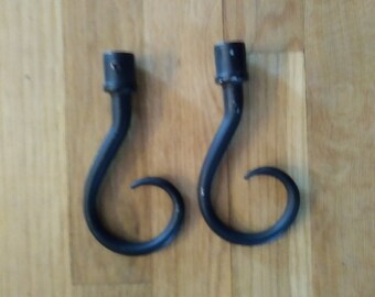 Pair of black curl design curtain rod brackets