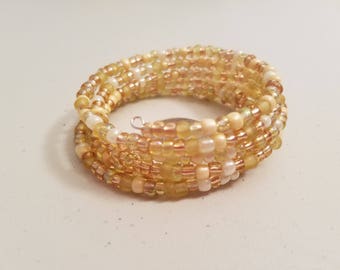 Gold and cream coil bracelet