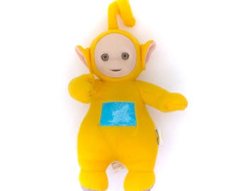 yellow teletubby doll