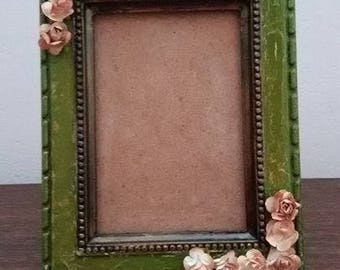 Rustic photo frame with twelve paper beige roses. This photo frame is a magnificent setting for your favorite photos. Vintage, wood, paper.