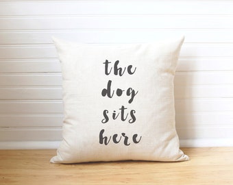 the dog sits here pillow