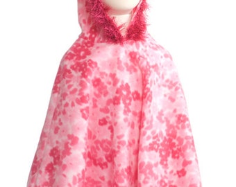 Girls fleece poncho with crocheted eyelash yarn trim around hood and bottom.
