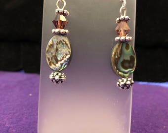 Brown and irridescent drop earrings.