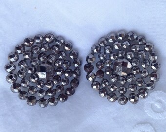 Cut steel buttons