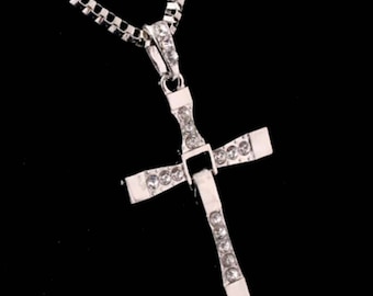 Back by popular demand, you've see the movie now own a piece of it. Toreto cross Necklace.