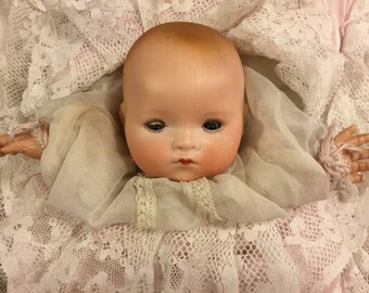 Sweetest Antique German bisque puppet baby in pillow/Pillow puppet