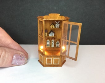 Miniature micro 1:48 or 1/24th scale cabinet with lights and tiny dollshouses inside