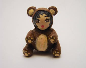 Doll dressed as a bear