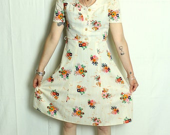 Vintage dress with beige flowers