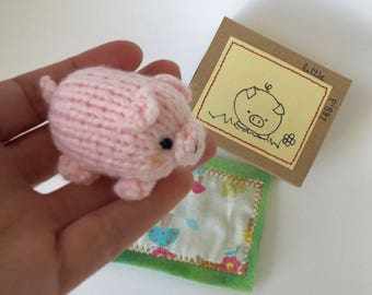 One very very cute hand knitted Piggy