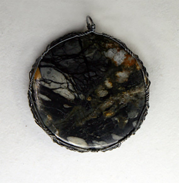 Cabochon of Picasso jasper in a Celtic wrap