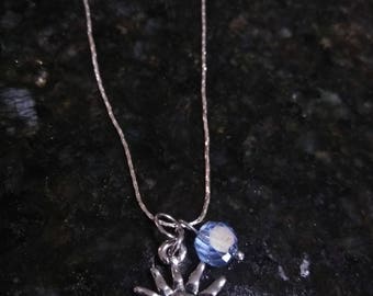 Silver slide clasp chain with a shiny silver sun charm