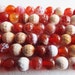 Fire Agate. Faceted 6mm Round Beads. Dyed. Orange/Red/White. 15.5" Strand.