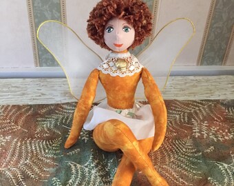 Fairy in muted gold fabric