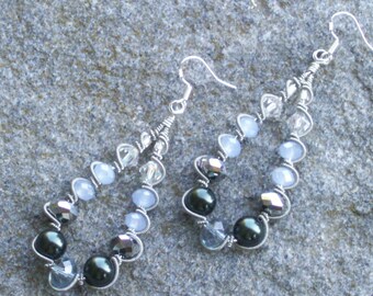 Silver wire wrapped earrings with silvery and blue crystals , deep blue pearls silvery coils