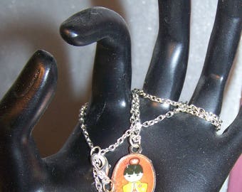 Necklace little Japanese gheisha on red background