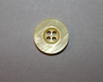 marbled yellow round button carved with four holes