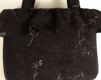 Little girl's little black purse