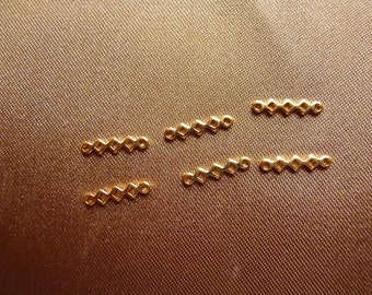 Link, gold-plated brass, 7x2mm triple open diamond, Pack Of 18 links.