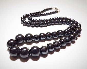 Hematite Pearl Necklace: 21.5" hematite Czech glass pearl necklace. Portion of sale goes to charity.