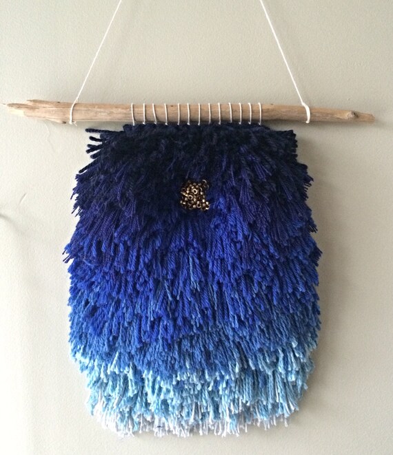 Items similar to Blue ombré woven wall hanging with raw brass beads on Etsy