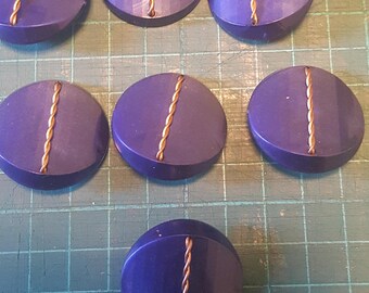 7 black and metal buttons from the 1960's