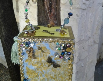 Cigar Box Purse, sky blue hand painted fabric, decorated with many metal charms, old key, dragonfly, clock face, crown, beaded handle & more