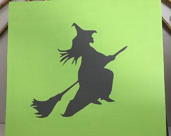 Flying witch on a broom wooden sign