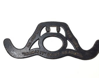 Inaminit skirt measure, 1905 NY, seamstress, sewing notions, antique cast iron, cast iron tool, novelty, wall decor,
