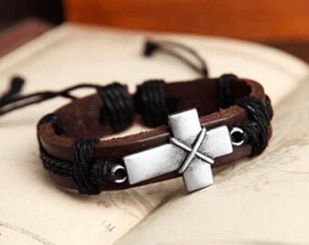 Leather bracelet with woven string ans metal cross.