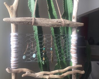 Nude, worn - Bo, driftwood, wire chicken: for an ethnic Bohemian vibe.