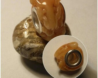 Beautiful carved amber charm bead