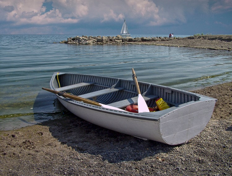 Wooden Row Boat on the shore of Lake Ontario in Toronto Canada