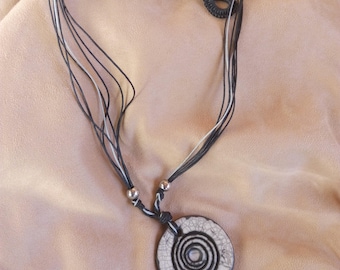 Multiwire necklace with double face ceramic pendant raku