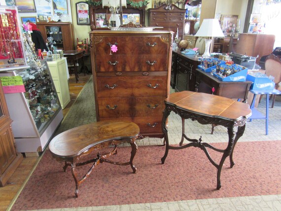Burl wood kidney shape coffee table with hand carved detail